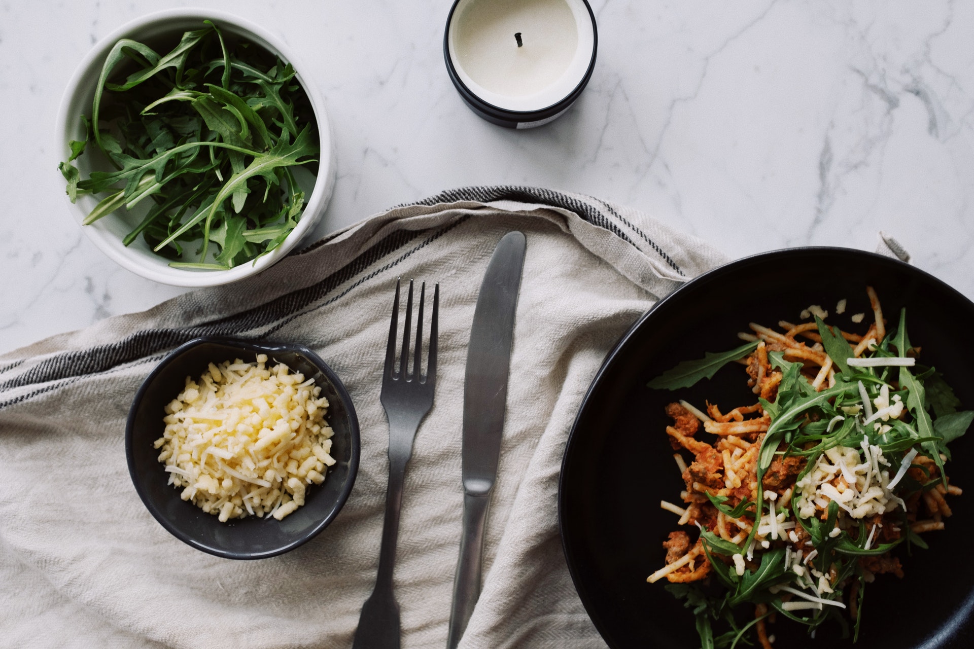 appetizing-meal-served-with-cheese-and-arugula-on-table-3851122.jpg